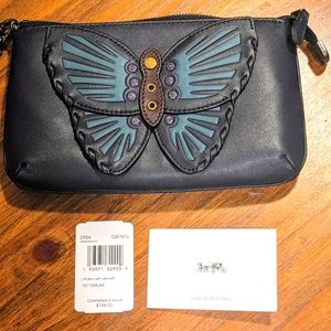 New with tags COACH large navy Butterfly wristlet....retails $200+ new